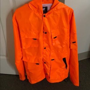 This is a bright orange jacket mens small.